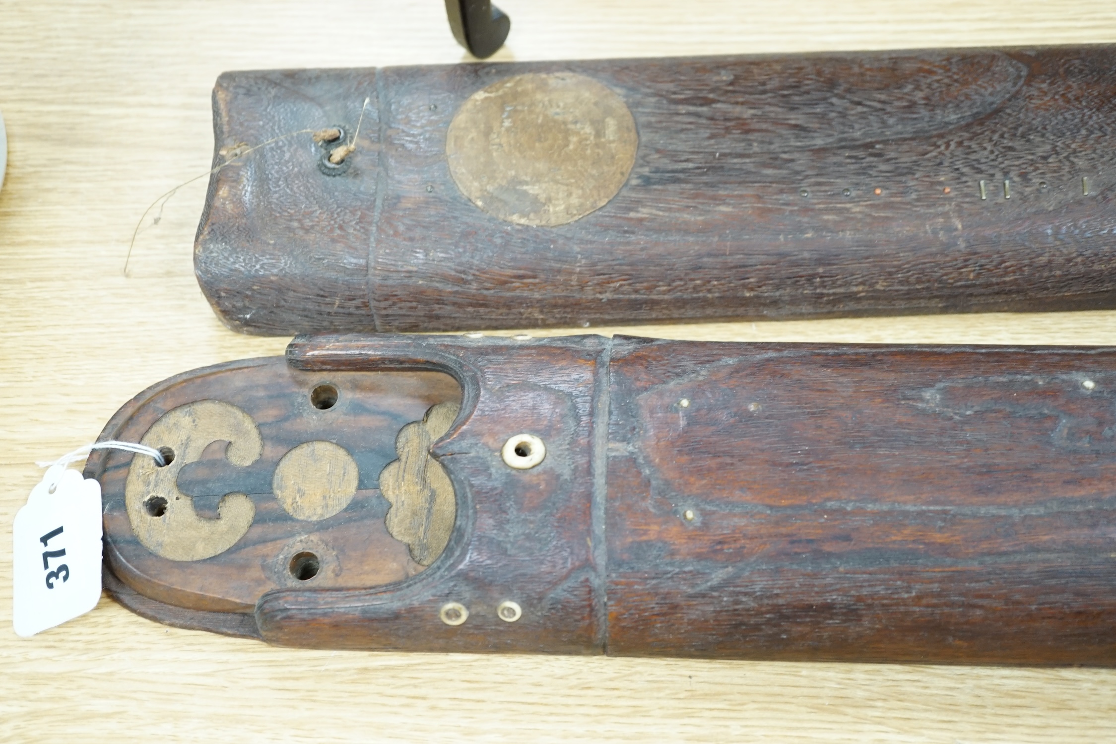 Two Japanese musical instruments and a stand, together with three catalogues, instruments 108cm long